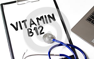 Doctor holding a card with text VITAMIN B12,medical concept