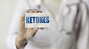 Doctor holding a card with text word KETONE  medical concept photo