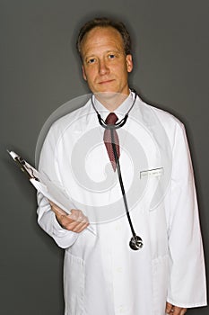 Doctor holding clipboard