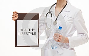 Doctor holding a clipboard and calling to healthy lifestyle