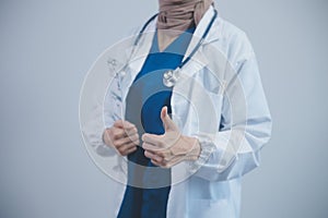 Doctor holding clipboard and stethoscope on background of Hospital ward