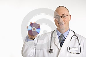 Doctor holding compact disc. photo