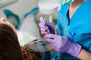 Doctor holding a composite cements for the treatment
