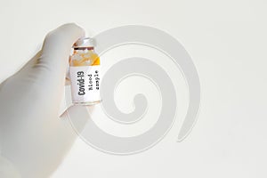 Doctor holding covid-19 sample in hands isolated against white background. Coronavirus sample