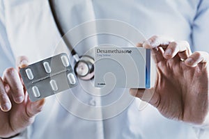 Doctor holding Dexamethasone steroid drug photo