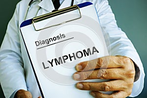 Doctor is holding Diagnosis Lymphoma photo