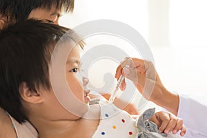 Doctor holding digital thermometer to measuring temperature