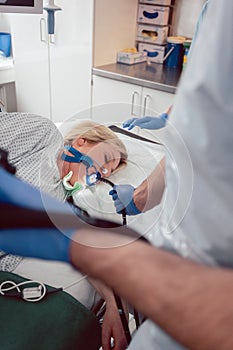 Doctor holding endoscope during gastroscopy in hand