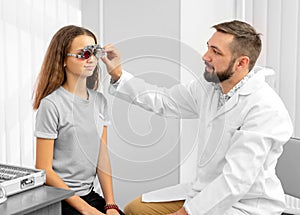 Doctor holding eye equipment