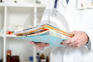 Doctor holding files