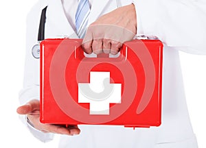 Doctor holding first aid box