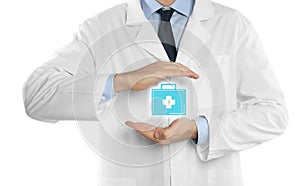 Doctor holding first aid kit icon against white background.