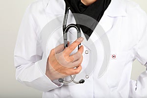 A Doctor holding a glass of Whisky