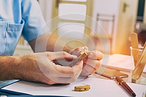 Doctor holding hearing aid photo