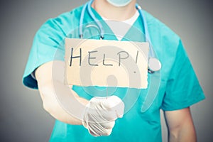 A doctor holding a help sign isolated