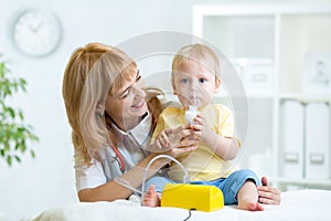 Doctor holding inhaler mask for child breathing