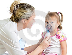 Doctor holding inhaler mask for kid breathing