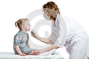 Doctor holding inhaler mask for kid breathing