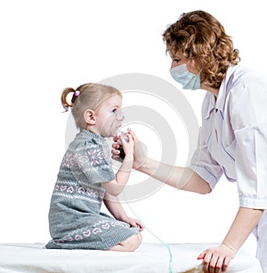 Doctor holding inhaler mask for kid breathing