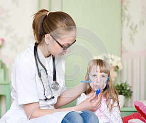 Doctor holding inhaler mask for kid breathing