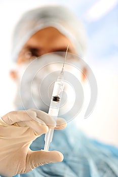 Doctor holding injection vaccine