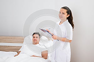 Doctor holding medical reports of patient