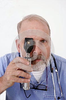 Doctor holding ophthalmoscope
