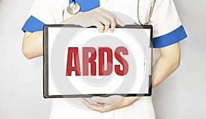 Doctor holding a paper plate with text ARDS, medical concept