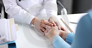 Doctor holding patient hands and soothing 4k movie slow motion