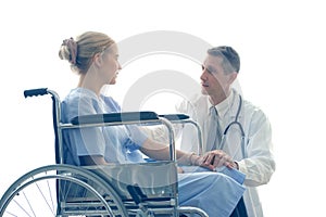 Doctor holding patient hand who setting on wheelchair  doctor cheer up patient to make feel reassured and photo