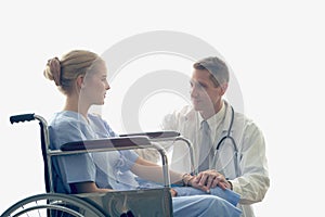 Doctor holding patient's hand who setting on wheelchair  doctor cheer up patient to make her feel reassured and photo