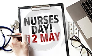 Doctor holding a pen and card with text nurses day 12 may, medical concept