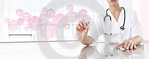 Doctor holding pill medicine with pink icons. Health care concept