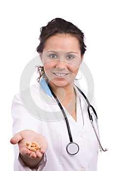 Doctor holding pills.