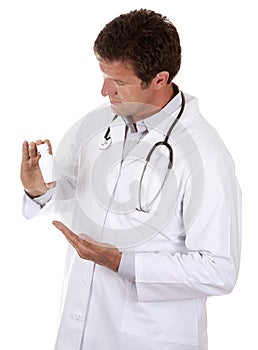 Doctor holding pills