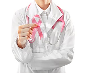 Doctor holding pink ribbon on white background. Breast cancer awareness concept