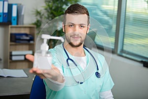 Doctor holding pump dispenser antibacterial handwash