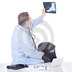 Doctor holding X-ray slide up