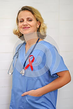 Doctor holding red ribbon. AIDS, HIV