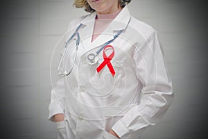 Doctor holding red ribbon. AIDS, HIV