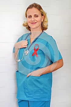 Doctor holding red ribbon. AIDS, HIV