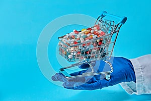 Doctor Holding Shopping Cart With Full Of Pills.