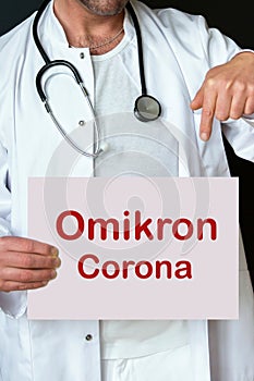 Doctor holding sign with the words omikron corona photo