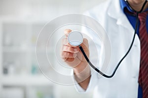 Doctor holding stethoscope