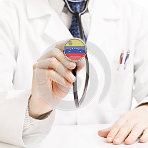 Doctor holding stethoscope with flag - Venezuela