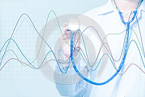 Doctor holding a stethoscope with graph on blue background.