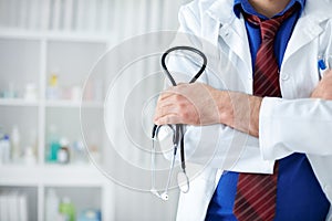 Doctor holding stethoscope in his hand