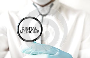 Doctor holding a stethoscope with text DIGITAL MEDICINE, medical concept