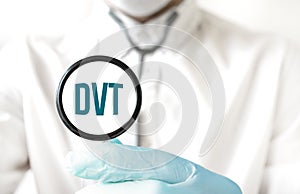 Doctor holding a stethoscope with text DVT, medical concept