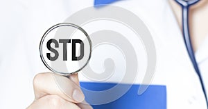 Doctor holding a stethoscope with text STD medical concept